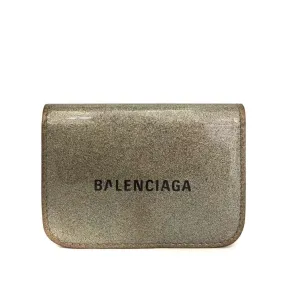 Balenciaga, gold leather wallet with two compartments and a snap close change purse & tri-fold wallet