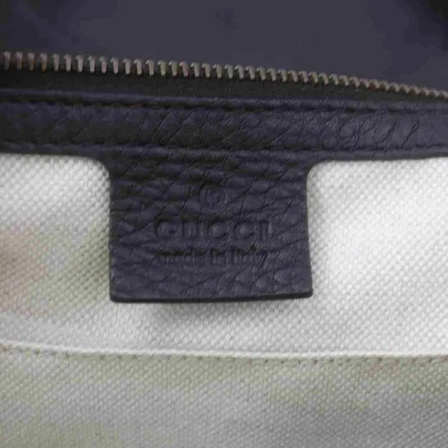 Gucci, brown on tan diamante print canvas and brown leather, XL '1973' top handle shoulder bag with a bold gold GG accent