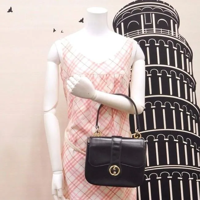 RARE, vintage Gucci, mod, black leather, two-way top handle style purse with gold tone accents