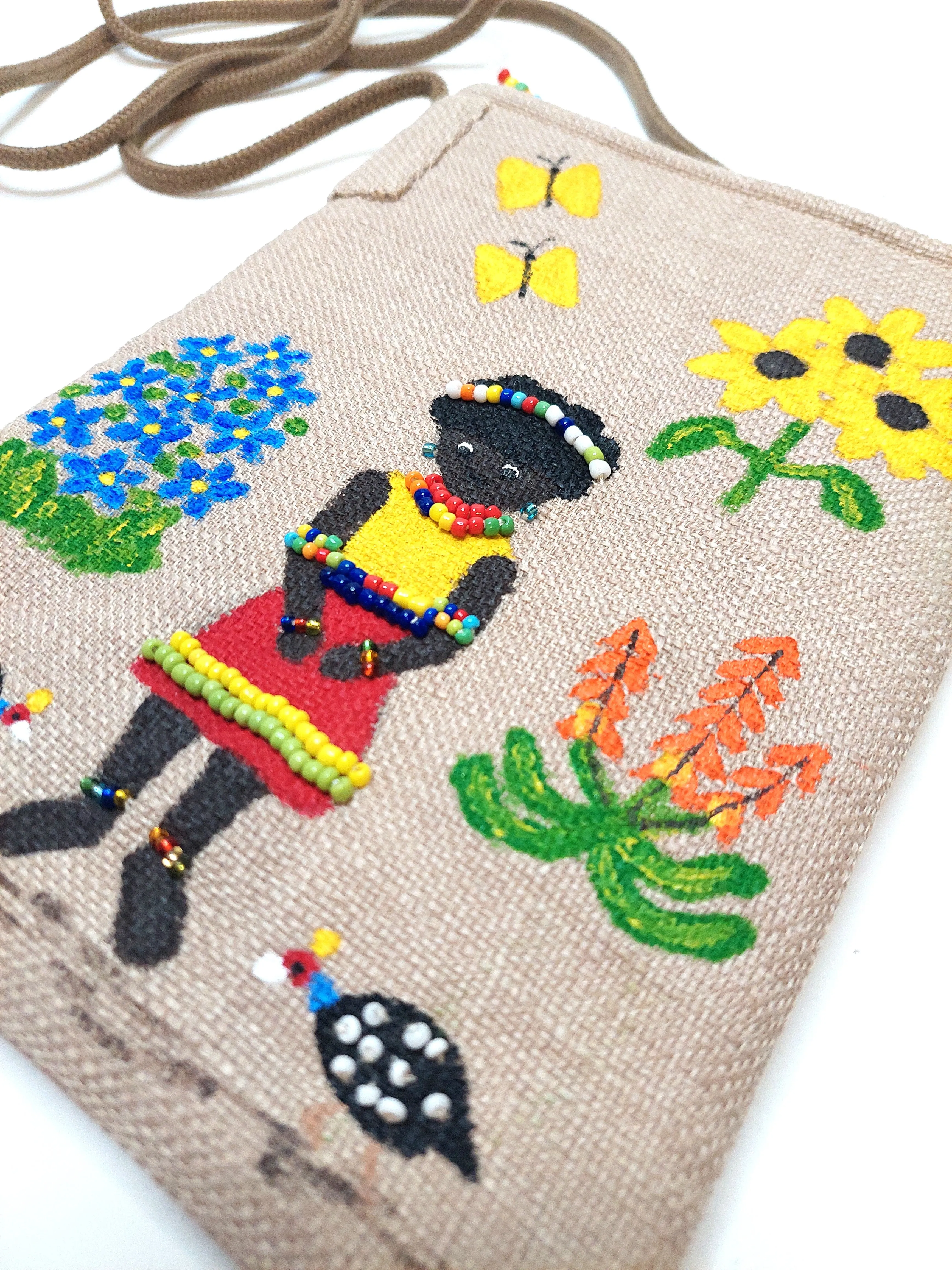 small beaded, hand painted sling bag lined with shweshwe