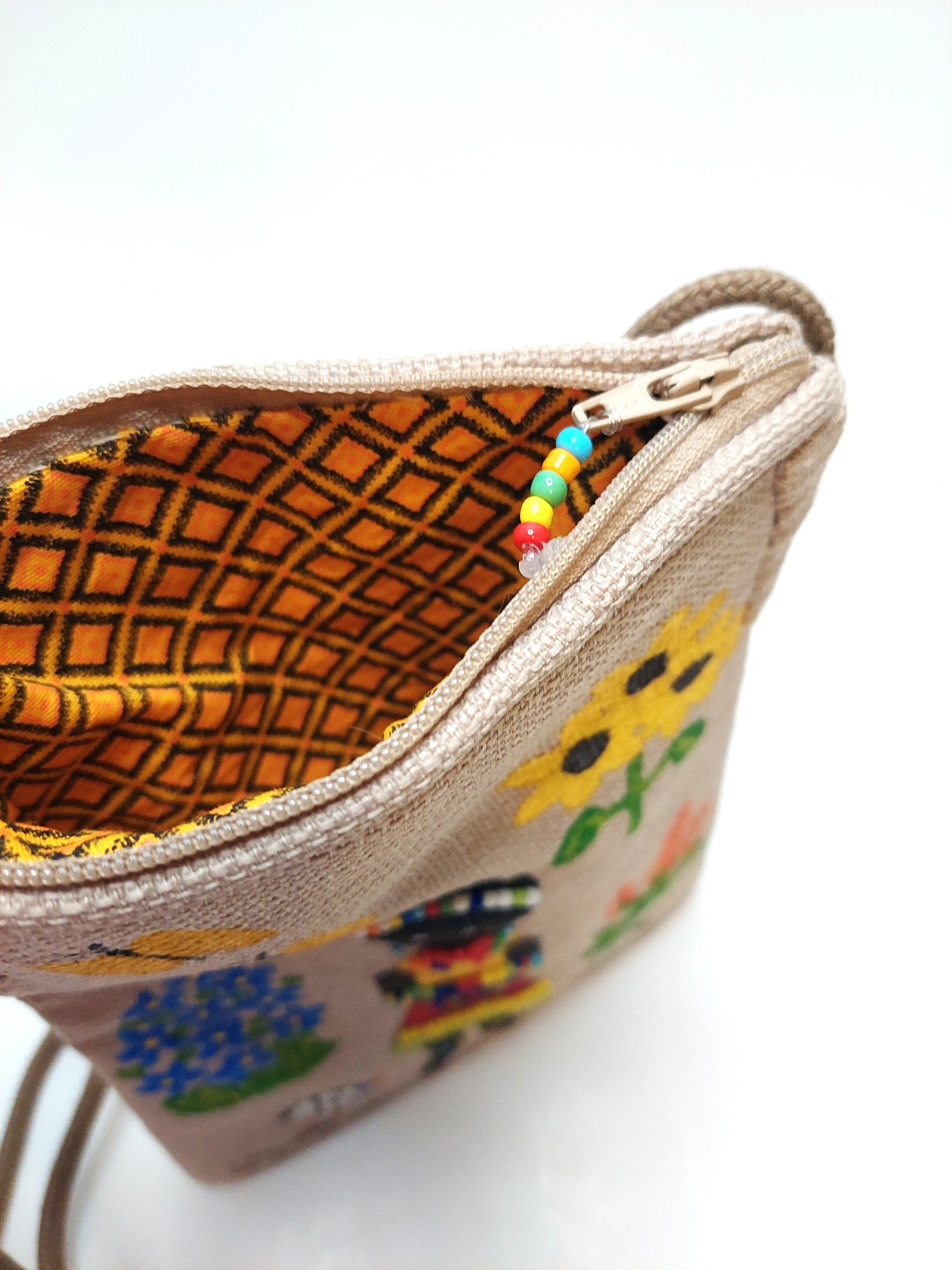 small beaded, hand painted sling bag lined with shweshwe