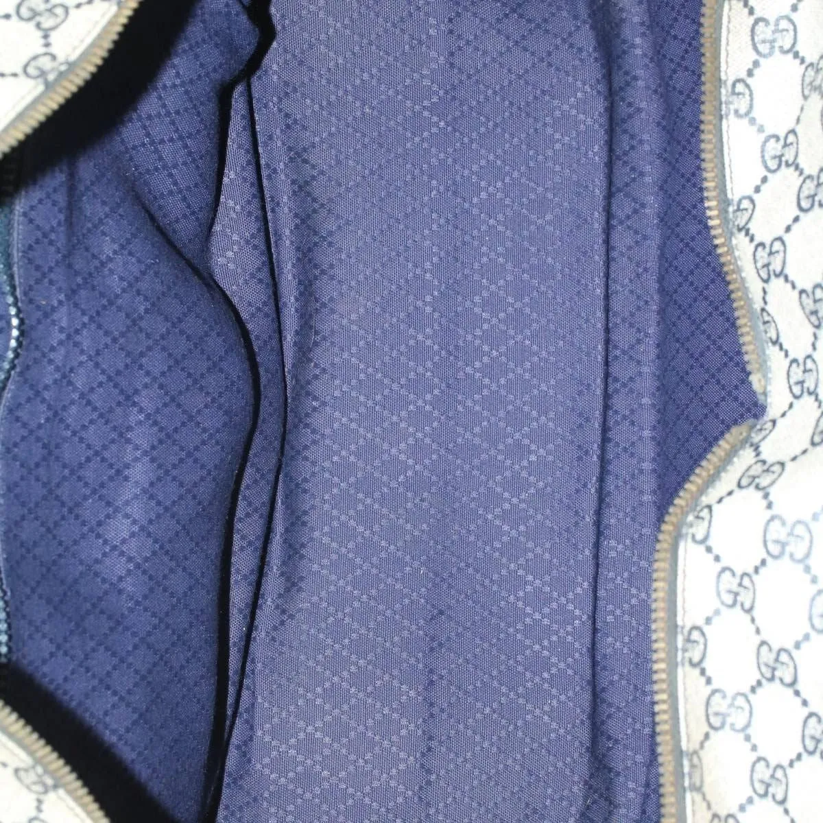 Very unusual, Gucci, blue Guccissima print & navy leather with wide red and blue striped corners, a footed bottom, dual zip closure top